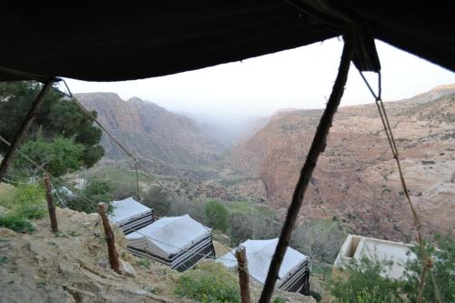 a view from inside a tent looking at a canyon at Dana Village lodge and Camp-Wadi Dana Eco camp in Dana