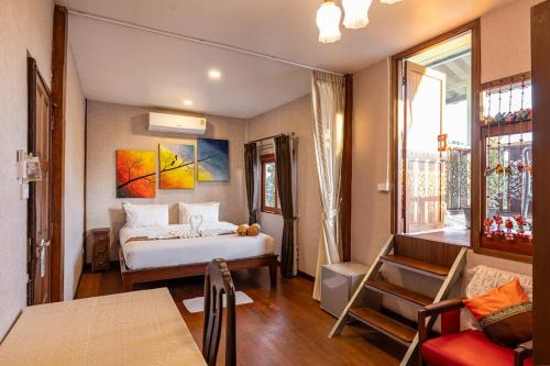 Ένα ή περισσότερα κρεβάτια σε δωμάτιο στο Banana House