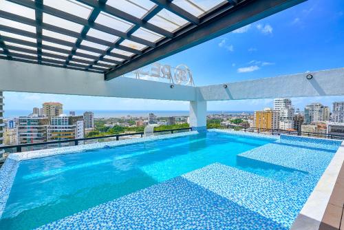 a large swimming pool on top of a building at ® {The~City~LUX~Place}@DowtownSD in La Julia