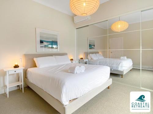 Ένα ή περισσότερα κρεβάτια σε δωμάτιο στο Surf Beach Remote Retreat - Linen Included