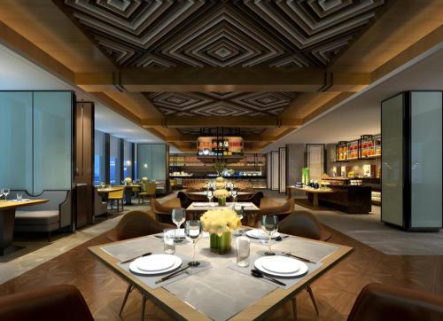 a dining room with a table and chairs at Shunshine International Hotel Xiangxi in Ganziping
