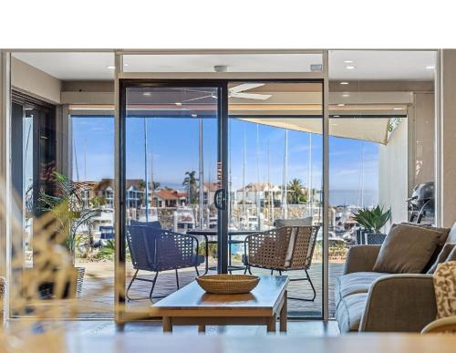 a living room with a couch and chairs and a table at Oceans Adrift in Largs