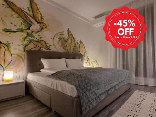 a bedroom with a large bed with a red at Apartament Maia Baile Felix in Baile Felix