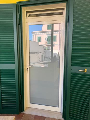 a sliding glass door with a view of a building at Dimora Sanfelice in Afragola