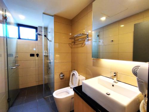 a bathroom with a sink and a toilet and a shower at Genting RelaxingColdStudio AT Ion Delemen in Genting Highlands