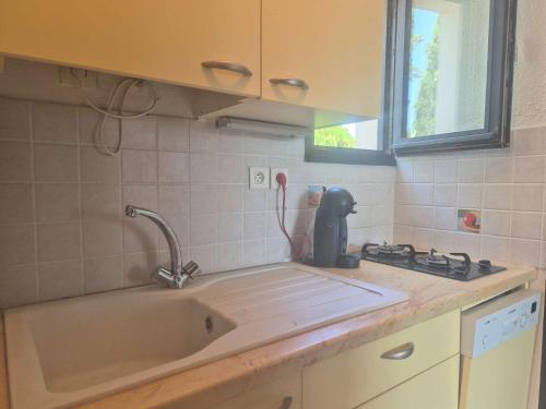 a kitchen counter with a sink and a mixer at Appartement 2 pièces CAP D'AGDE CT865-2113 in Cap d'Agde