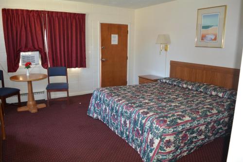 Кровать или кровати в номере Ventura Motel