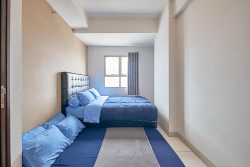 Ένα ή περισσότερα κρεβάτια σε δωμάτιο στο Mekarwangi Square by Eazystay