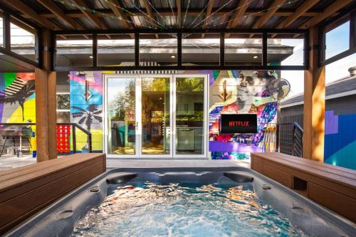 a hot tub in the middle of a building at City Views Rooftop Karaoke, Pool, Hot Tub, Games in San Antonio