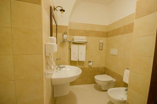 a bathroom with a sink and a toilet at Il Casino di Remartello in Loreto Aprutino