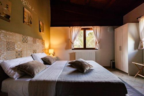 Postel nebo postele na pokoji v ubytování B&B Villa Adriana