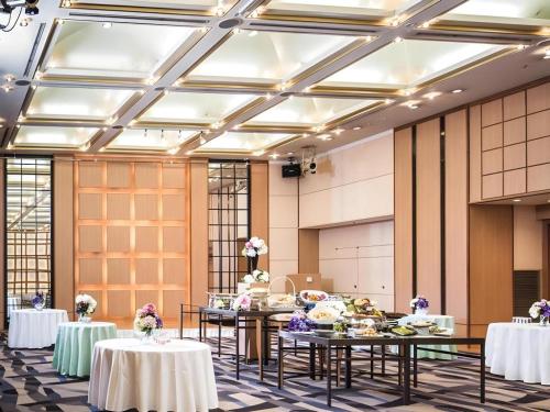 a banquet hall with tables with food on them at Nagoya Sakae Tokyu REI Hotel in Nagoya