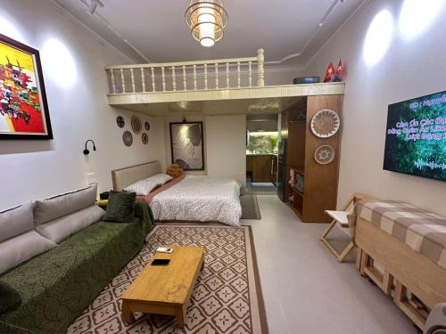 a living room with a couch and a loft bed at Hanoi An - 1'walk to Hoan Kiem lake - Hanoi Center in Hanoi