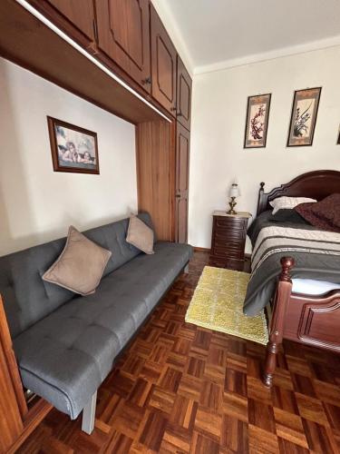 a living room with a couch and a bed at Spray B&B Sitio in Nazare, European style in Nazaré