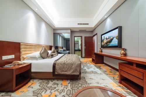 Postel nebo postele na pokoji v ubytování Hangzhou Haiwaihai Hotel