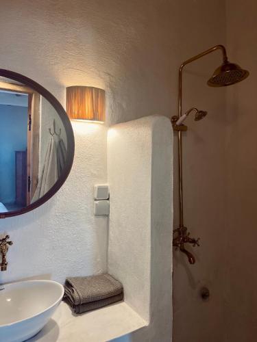 a bathroom with a sink and a mirror at Wilde Tigmi in Essaouira
