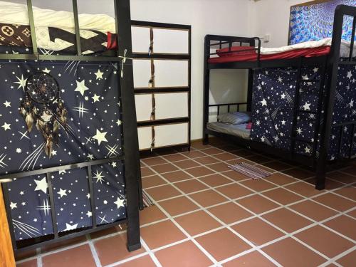 a room with two bunk beds with stars on them at Soundgarden Kohrong Dorm in Koh Rong