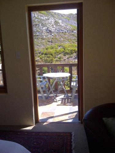 Ένα ή περισσότερα κρεβάτια σε δωμάτιο στο Agulhas Country Lodge