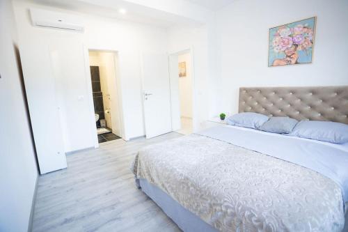 Ένα ή περισσότερα κρεβάτια σε δωμάτιο στο Vila la Vita