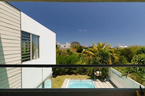 a view from the balcony of a house with a swimming pool at Serenity in La Gaulette