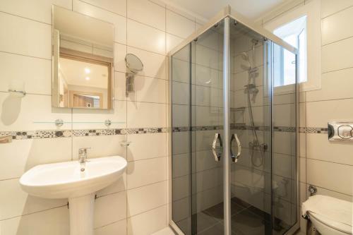 a bathroom with a sink and a shower at Villa Tara in Ovacik