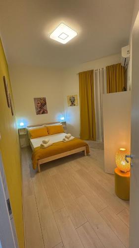 a bedroom with a bed in a room at House Mari in Catania