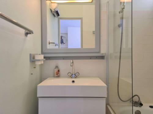 a white bathroom with a sink and a shower at T2 cabine - CAP D'AGDE CT300-124 in Cap d'Agde