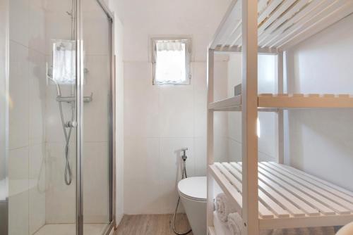 a bathroom with a bunk bed and a toilet at Villa Carla in Salò