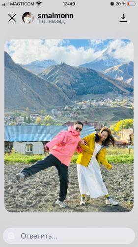 a man and a woman dancing on the beach at Cottage Nishi in Kazbegi