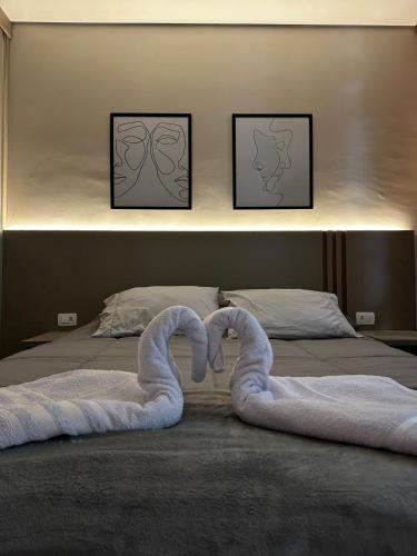 Кровать или кровати в номере Studio Aconchego Poços - Minimalista e bem localizado