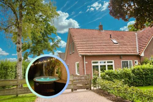 a house with a mirror in front of it at Vakantiewoning buitenaf in Hellendoorn