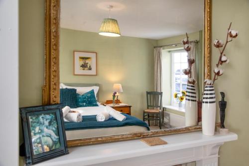 Postel nebo postele na pokoji v ubytování Saffron Cottage