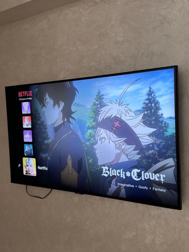 a flat screen tv with a video game on it at Spacious Apartment in heart of Agadir in Agadir