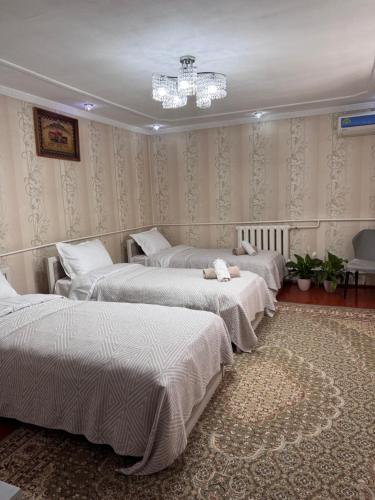 Katil atau katil-katil dalam bilik di Cozy Guest House