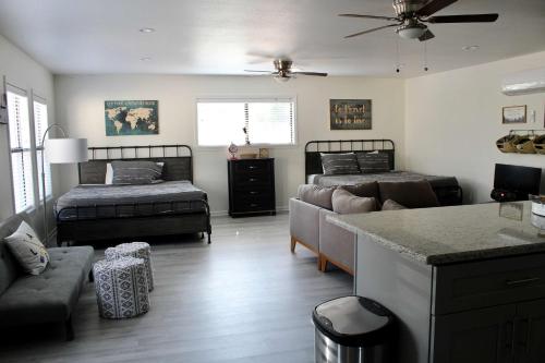 a living room with two beds and a couch at Shore Nuff a relaxing 4-bedroom vacation home on Canyon Lake in Canyon Lake