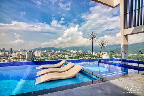 a swimming pool with a view of a city at 22 Macalisterz by ALV in George Town