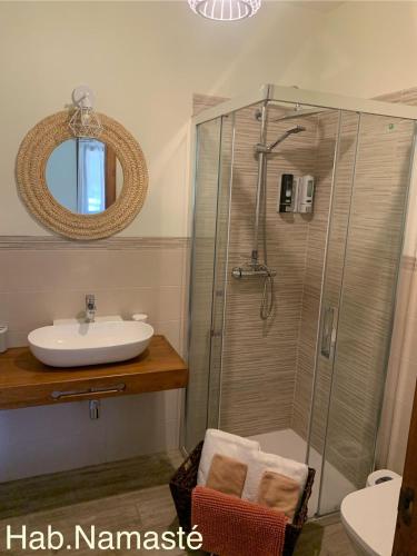 a bathroom with a shower and a sink at CASA PARVATHI CANDELEDA in Candeleda