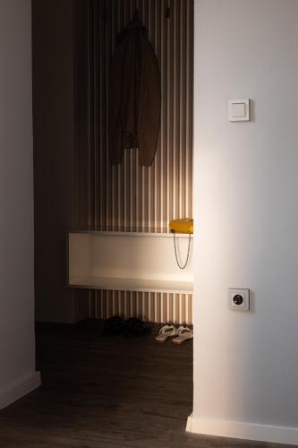 a room with a hallway with a wall with stripes at ART Apartments in Dvůr Králové nad Labem