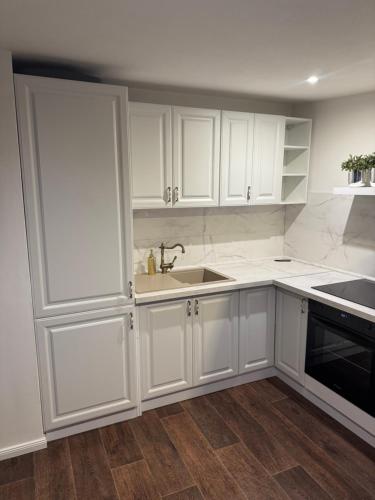 Kuchyň nebo kuchyňský kout v ubytování ROYAL Apartment
