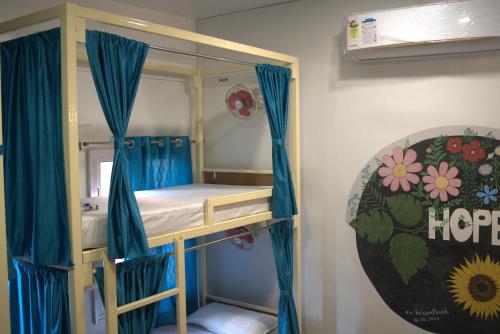 Postel nebo postele na pokoji v ubytování Kashi Vibes Hostel