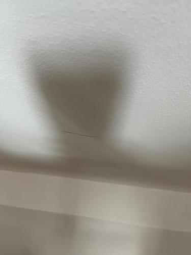 a white ceiling with a hole in the middle at Dunfermline Retreat 3br Wi-fi Private Parking in Townhill
