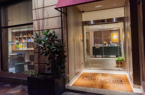 a store front with a sign on the door at Hotel California in Barcelona