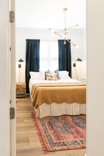 a bedroom with a bed and a window at The Chattanooga Crossroads Condo in Chattanooga