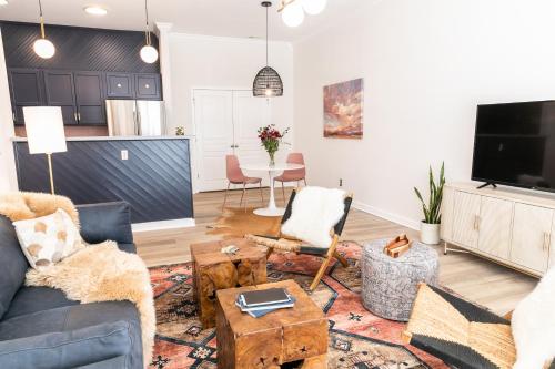 a living room with a couch and a table at The Chattanooga Crossroads Condo in Chattanooga