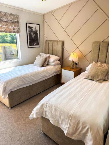 Ένα ή περισσότερα κρεβάτια σε δωμάτιο στο Seaview Lodge Anglesey