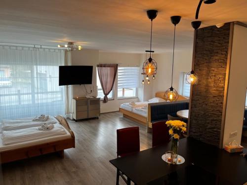 a hotel room with a bedroom and a living room at Rohrbacher Herz II in Berg bei Rohrbach