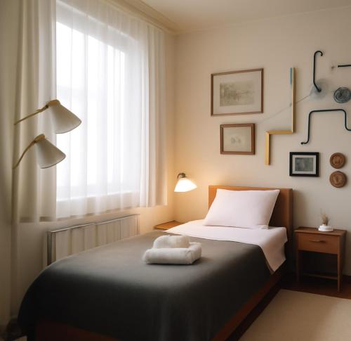 Una cama o camas en una habitación de ML Apartman