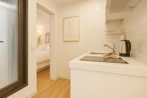 Postel nebo postele na pokoji v ubytování N Village