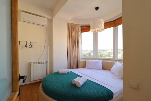 Llit o llits en una habitació de Wehost-Dream Penthouse