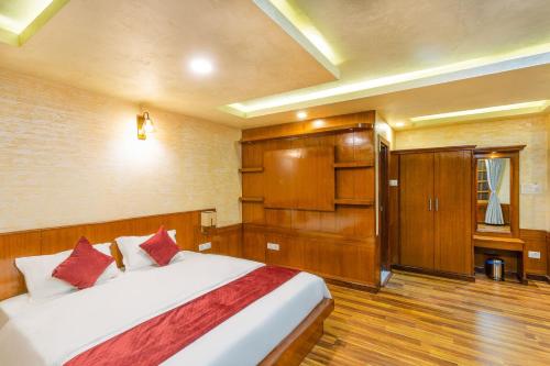 En eller flere senge i et værelse på Hotel Nova Nook Pvt Ltd